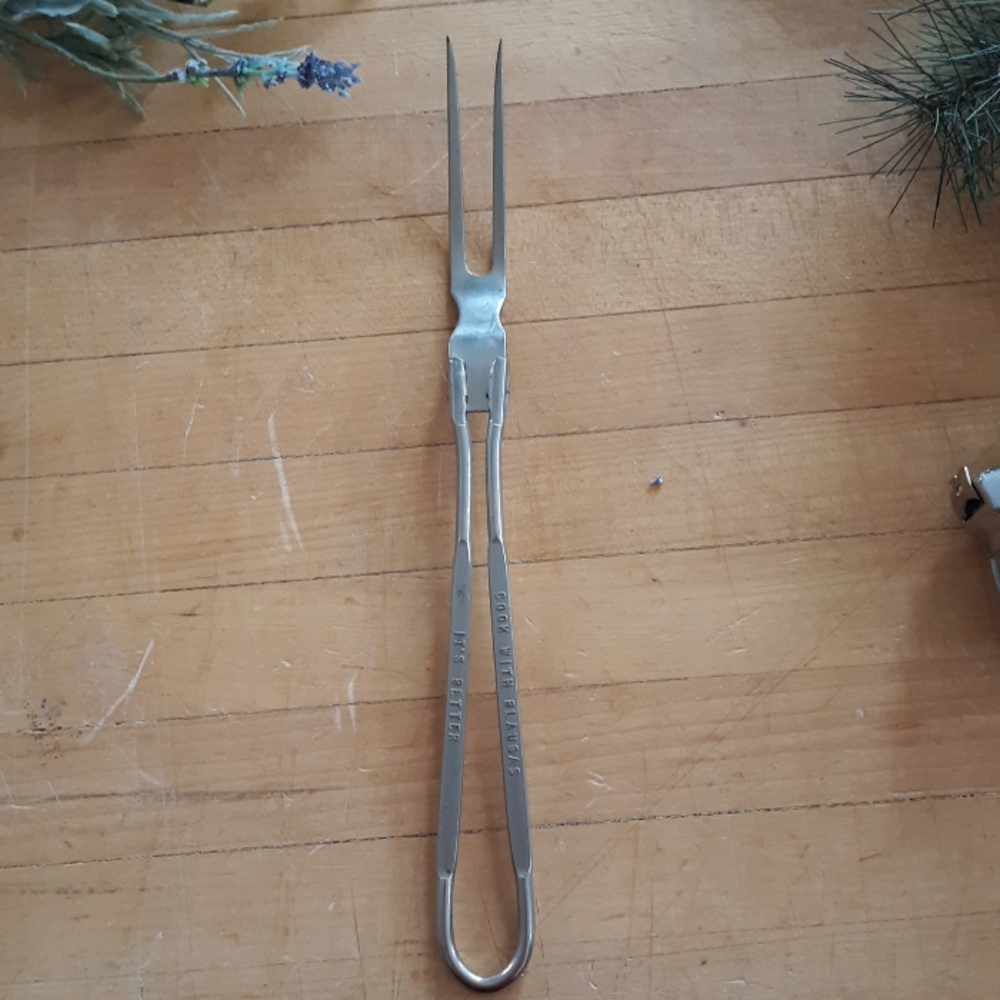 Metal serving fork with advertising